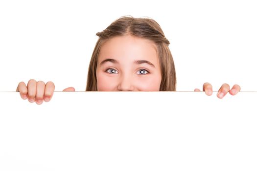 Cute little girl behind a white board