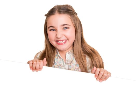 Cute little girl behind a white board