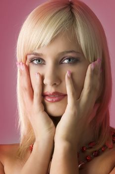 cute blond girl with glamor make up with red necklace