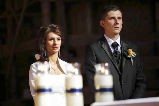 Bride and Groom in the church during wedding ceremony