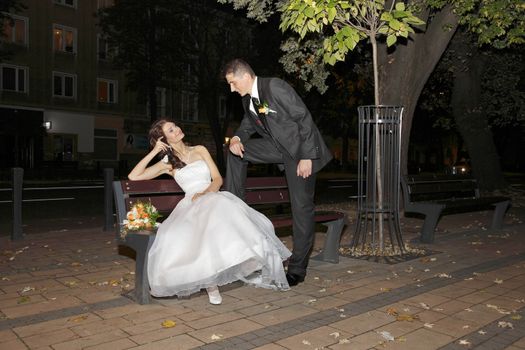 Bride and Groom in the park with the bridal bouquet