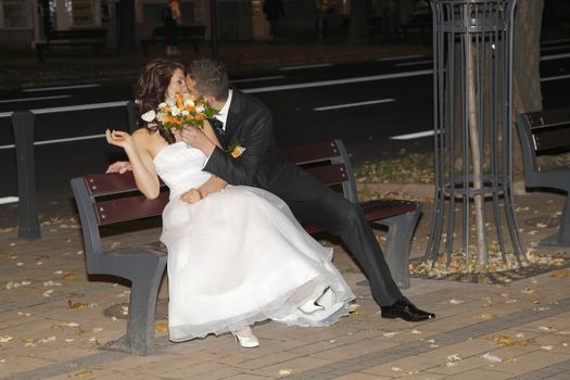 Bride and Groom in the park with the bridal bouquet