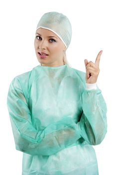 young beauty nurse in green operation dress acting to the camera