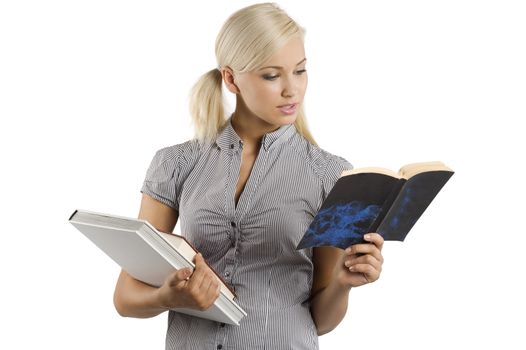 pretty young blond student in casual dress reading a book. isolated over white