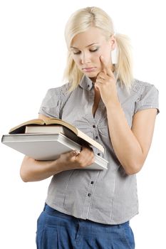 beautiful young student thinking while she is reading a book