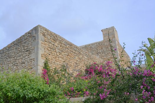 Drystone Building Without Windows and pink bougainvillea. Mallorca, Balearic islands, Spain.