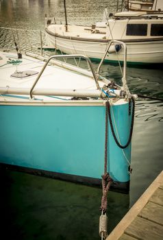Turquoise sailboat in port, moored. Mallorca, Balearic islands, Spain.