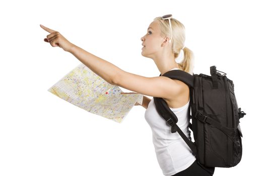 cute blond tourist girl with map and backpack point her finger at something