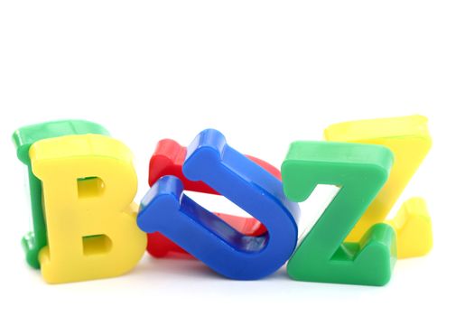 Close-up of letters. "Buzz" word.