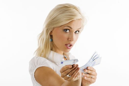 blond girl looking in camera with some money in hand in act to give an euro bill
