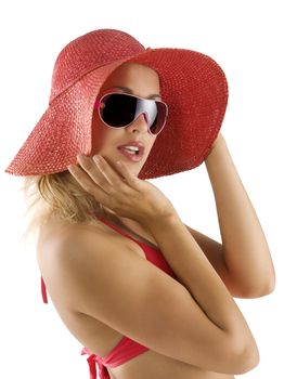 closeup portrait of pretty blond woman wearing a nice summer red hat and sunglasses