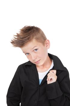 Charming casual kid in black dress shirt and fashionable haircut with cool pose isolated on white background. 