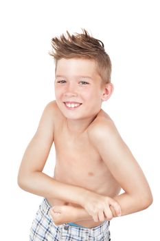 Charming caucasian young boy without shirt showing muscle. Morning hygiene concept.