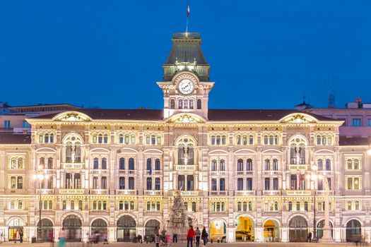 The City Hall, Palazzo del Municipio, is the dominating building on Trieste's main square Piazza dell Unita d Italia. Trieste, Italy, Europe. Illuminated city square shot at dusk.