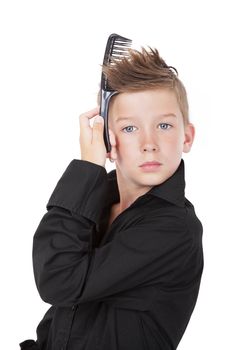 Charming fashionable boy with hairbrush isolated on white background. Young man.