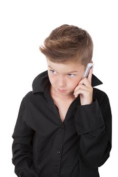 Charming young boy calling from cell phone isolated on white background. Fresh internet business concept.