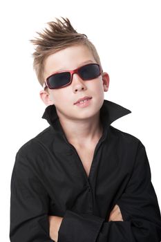 Confident charming young boy with black dress shirt and sunglasses isolated on white background.