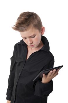 Cool boy in black dress shirt holding tablet isolated on white background. Contemporary technology concept. Generation Z.
