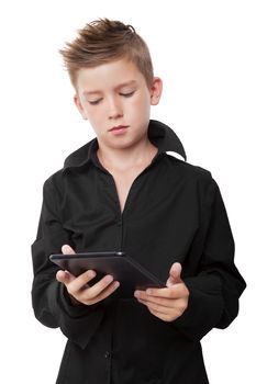 Casual boy with black dress shirt and cool haircut holding tablet isolated on white background.
