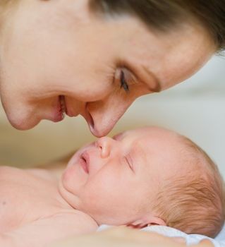 Closeup Portrait Mother and a newborn baby boy, 11 day old