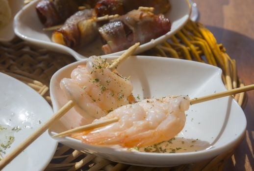 Shrimp tapas on sticks. Tapas on sticks in a restaurant. Mallorca, Balearic islands, Spain.