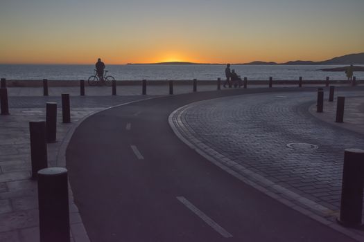 Curved Road Sunset. Road following the coastline in Can Pastilla, Mallorca, Balearic islands, Spain.