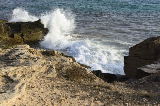 Crashing Wave Sea Foam at Ses Covetes, Mallorca, Balearic islands, Spain.