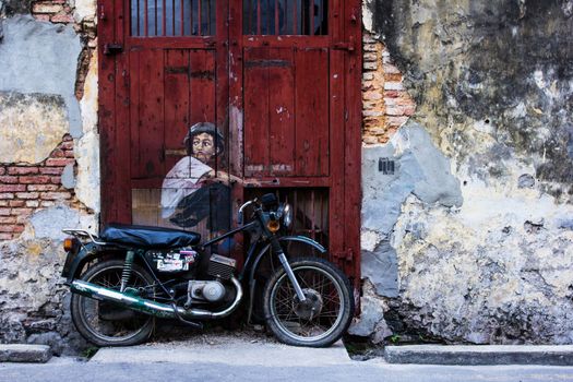 General view of a mural 'Boy on a Bike' painted by Ernest Zacharevic in Penang on July 6, 2013. The mural is one of the 9 murals paintings in early 2012.