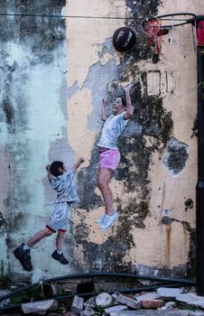 PENANG, MALAYSIA-FEB 14: Street Mural tittle 'Little Children on a Bicycle' painted by Ernest Zacharevic in Penang on Feb.14, 2012. It was painted in conjunction with the 2012 George Town Festival.