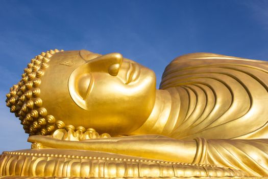 Face of Reclining buddha at thailand. Generality in Thailand, This photo is public domain or treasure of Buddhism, no restrict in copy or use. No any trademark or restrict matter in this photo.