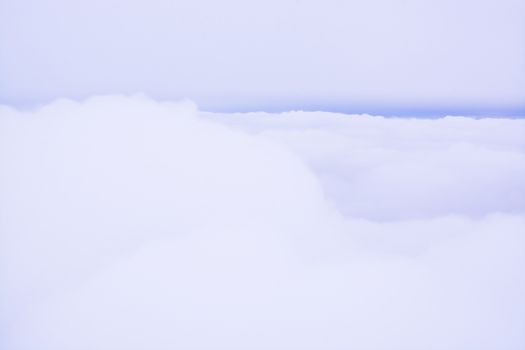 Fluffy Clouds Blue Line. Cloud cover in flight, artistic abstract for background or wallpaper.