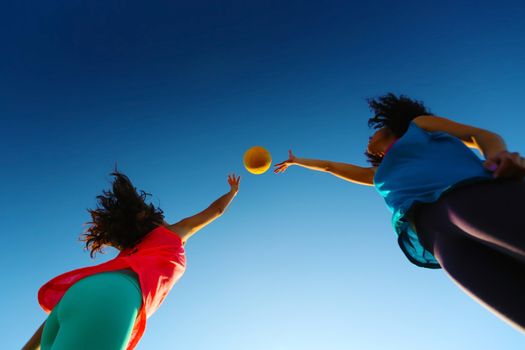 Women playing with a ball in the city park