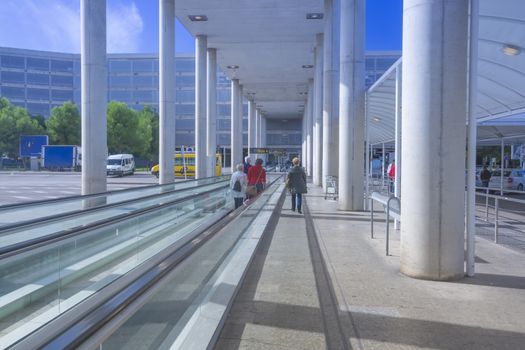 Palma airport Son Sant Joan outdoors on walkway towards buses and parking garage, in sunny weather and blue sky. Palma de Mallorca, Balearic islands, Spain in November.