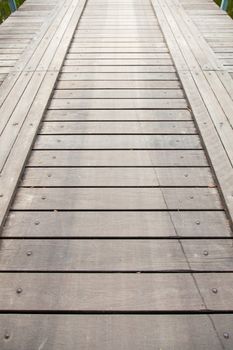 Long wooden bridge ahead. For the car and walk across the pool.