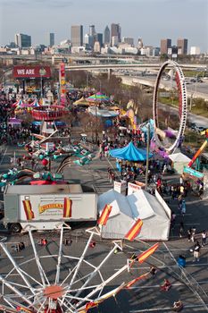 Atlanta, GA, USA - March 15, 2014:  Elevated wide shot of annual Atlanta Fair, with city skyline in background.