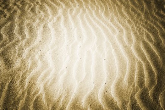 Beach with soft sand, rippled texture of windblown effect