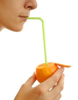 Orange in a girl hand with a straw