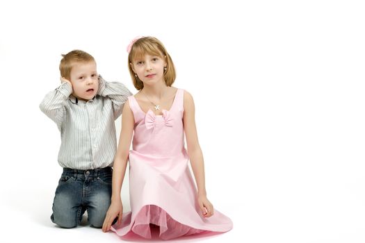 Studio portrait of siblings beautiful boy and girl on white background