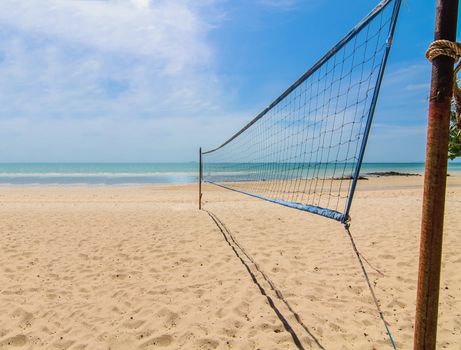 The beach volleyball net on a sunny day with blue sky