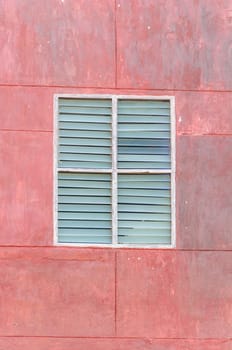 Grunge window were painted red color.