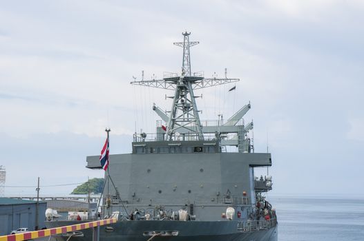 Battleship docked at the harbor. Bow with anchor