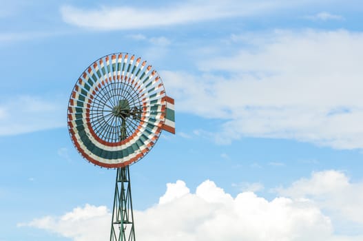 Wind turbine is a circle and the sky.
Thailand