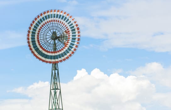 Wind turbine is a circle and the sky.
Thailand