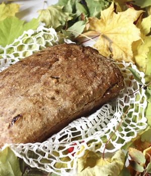 Loaf of bread and  still life on rustic background