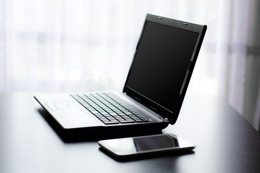 Modern laptop and tablet in office