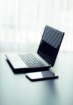 Modern laptop and tablet in office