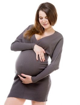 young pregnant girl hugging her belly isolated on white background