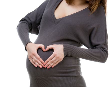 pregnant woman holding hands in heart shape isolated on a white background