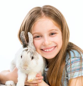 cute smiling little girl with white Easter bunny