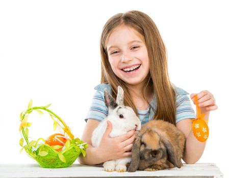 smiling little girl with two Easter bunny
